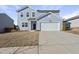 Charming two-story home with blue siding, a two-car garage, and a well-kept lawn at 3517 Strawberry Patch Row, Raleigh, NC 27604