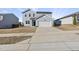 Charming two-story home with blue siding, a two-car garage, and a well-kept lawn at 3517 Strawberry Patch Row, Raleigh, NC 27604