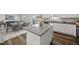 Open concept kitchen with a granite island, seamlessly flowing into the dining area and backyard access at 3517 Strawberry Patch Row, Raleigh, NC 27604
