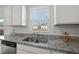 The Kitchen features modern sink with granite countertops, stainless steel appliances, and natural light at 3517 Strawberry Patch Row, Raleigh, NC 27604