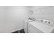 Functional laundry room with washer, dryer, and wire shelving for convenient storage at 3517 Strawberry Patch Row, Raleigh, NC 27604