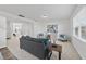 Spacious living room with neutral decor, plush carpet, and lots of natural light at 3517 Strawberry Patch Row, Raleigh, NC 27604