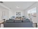 Bright living room featuring plush furniture, neutral decor, and large window at 3517 Strawberry Patch Row, Raleigh, NC 27604