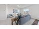 Inviting living room featuring carpet, neutral decor, and large window at 3517 Strawberry Patch Row, Raleigh, NC 27604