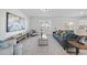 Cozy living room featuring plush furniture, neutral decor, and large windows at 3517 Strawberry Patch Row, Raleigh, NC 27604