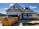 New home under construction featuring a garage and a bright blue sky background at 36 Mossman Ct, Zebulon, NC 27597
