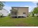 Expansive backyard featuring a charming screened porch, ideal for relaxing and entertaining outdoors at 3614 Kilgo Dr, Durham, NC 27705