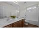Bathroom featuring dual sinks, modern finishes, and a tub/shower combination at 3614 Kilgo Dr, Durham, NC 27705
