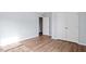 Bedroom featuring a modern design, hardwood flooring, and closet space at 3614 Kilgo Dr, Durham, NC 27705