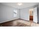 Bright bedroom features hardwood floors, closet, and doorway to the en suite bathroom at 3614 Kilgo Dr, Durham, NC 27705