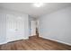 Bedroom with ample closet space, hardwood floors, and modern paint at 3614 Kilgo Dr, Durham, NC 27705