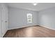 Bedroom featuring bright paint, hardwood flooring, and natural sunlight at 3614 Kilgo Dr, Durham, NC 27705