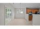 Bright dining area next to kitchen, featuring sliding glass doors to deck at 3614 Kilgo Dr, Durham, NC 27705