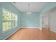 Bright dining room with hardwood floors, a chandelier, large windows offering natural light at 3614 Kilgo Dr, Durham, NC 27705