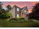 Charming brick home featuring a two-car garage, stone accents, and lush landscaping at 3614 Kilgo Dr, Durham, NC 27705