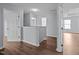 Upstairs hallway showcases hardwood flooring and access to bedrooms at 3614 Kilgo Dr, Durham, NC 27705
