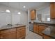Bright kitchen showcasing granite countertops, stainless steel appliances, cabinetry, and an island with seating at 3614 Kilgo Dr, Durham, NC 27705