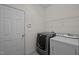 Functional laundry room featuring modern washer and dryer appliances at 3614 Kilgo Dr, Durham, NC 27705
