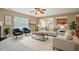 Cozy living room featuring comfortable seating, natural light, and an open layout with carpet flooring at 3614 Kilgo Dr, Durham, NC 27705