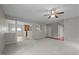 Open living room with hardwood flooring, leading to the kitchen and other living areas at 3614 Kilgo Dr, Durham, NC 27705