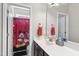 Bathroom boasts a Mickey Mouse shower curtain, neutral colors, and a granite countertop at 3621 Colby Chase Dr, Apex, NC 27539