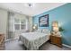 Comfortable bedroom with a serene blue accent wall, carpet, and coordinating decor at 3621 Colby Chase Dr, Apex, NC 27539