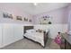 Charming bedroom showcasing a castle wall decal, pink walls, and themed decor at 3621 Colby Chase Dr, Apex, NC 27539