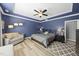 This primary bedroom boasts a trey ceiling, a ceiling fan, and accent lamps at 3621 Colby Chase Dr, Apex, NC 27539