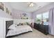 Charming bedroom features a castle-themed wall decal, a large bed, and a window with natural light at 3621 Colby Chase Dr, Apex, NC 27539