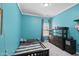Vibrant bedroom featuring blue walls, striped bedding, and a dark wood dresser at 3621 Colby Chase Dr, Apex, NC 27539