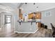 Modern kitchen with granite countertops, stainless steel appliances, breakfast bar, and pendant lighting at 3621 Colby Chase Dr, Apex, NC 27539
