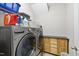 Well-organized laundry room with stainless steel washer/dryer and upper cabinets at 3621 Colby Chase Dr, Apex, NC 27539