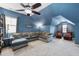 Spacious upstairs living room features vaulted ceiling, plush seating, and movie decor at 3621 Colby Chase Dr, Apex, NC 27539