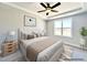 Bright and airy bedroom with a large window and stylish neutral decor provides a peaceful retreat at 37 Mossman Ct, Zebulon, NC 27597