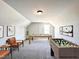 Spacious game room with a pool table and foosball, perfect for entertaining friends and Gathering at 37 Mossman Ct, Zebulon, NC 27597
