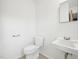 Powder room featuring neutral walls, toilet and sink at 3719 Hermine St, Durham, NC 27705
