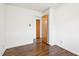 Bedroom featuring hardwood floors, closet, and white trim at 3719 Hermine St, Durham, NC 27705