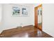 Bright bedroom with hardwood floors, closet, and natural light from double windows at 3719 Hermine St, Durham, NC 27705