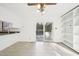 Dining area with tile floors, sliding glass doors to patio, and built in shelving unit at 3719 Hermine St, Durham, NC 27705