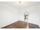 Dining room with hardwood floors and view into the kitchen with stainless appliances at 3719 Hermine St, Durham, NC 27705