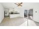 Bright kitchen features stainless steel appliances, tile floor, and sliding glass doors to the backyard at 3719 Hermine St, Durham, NC 27705