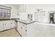 Eat-in kitchen with granite counters, stainless dishwasher, and view of spacious Gathering room at 3719 Hermine St, Durham, NC 27705