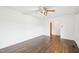 Living room featuring refinished hardwood floors, fresh paint and a ceiling fan at 3719 Hermine St, Durham, NC 27705