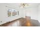 Cozy living room features a large window and gleaming hardwood floors at 3719 Hermine St, Durham, NC 27705