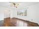 Living room with hardwood floors and large window allowing for plenty of natural light at 3719 Hermine St, Durham, NC 27705