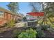 Charming backyard patio with outdoor seating, dining, and landscaping in a tranquil setting at 3719 Hermine St, Durham, NC 27705