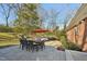 A spacious backyard patio area with dining and seating arrangements perfect for entertaining outdoors at 3719 Hermine St, Durham, NC 27705