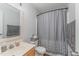 Cozy bathroom features a vanity sink and a shower-tub combo with a stylish shower curtain at 38 Colonial Hills Dr, Lillington, NC 27546