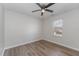 Bedroom featuring wood floors, neutral walls, a ceiling fan and window with blinds at 38 Colonial Hills Dr, Lillington, NC 27546