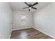 Bedroom featuring wood floors, neutral walls, a ceiling fan and window with blinds at 38 Colonial Hills Dr, Lillington, NC 27546